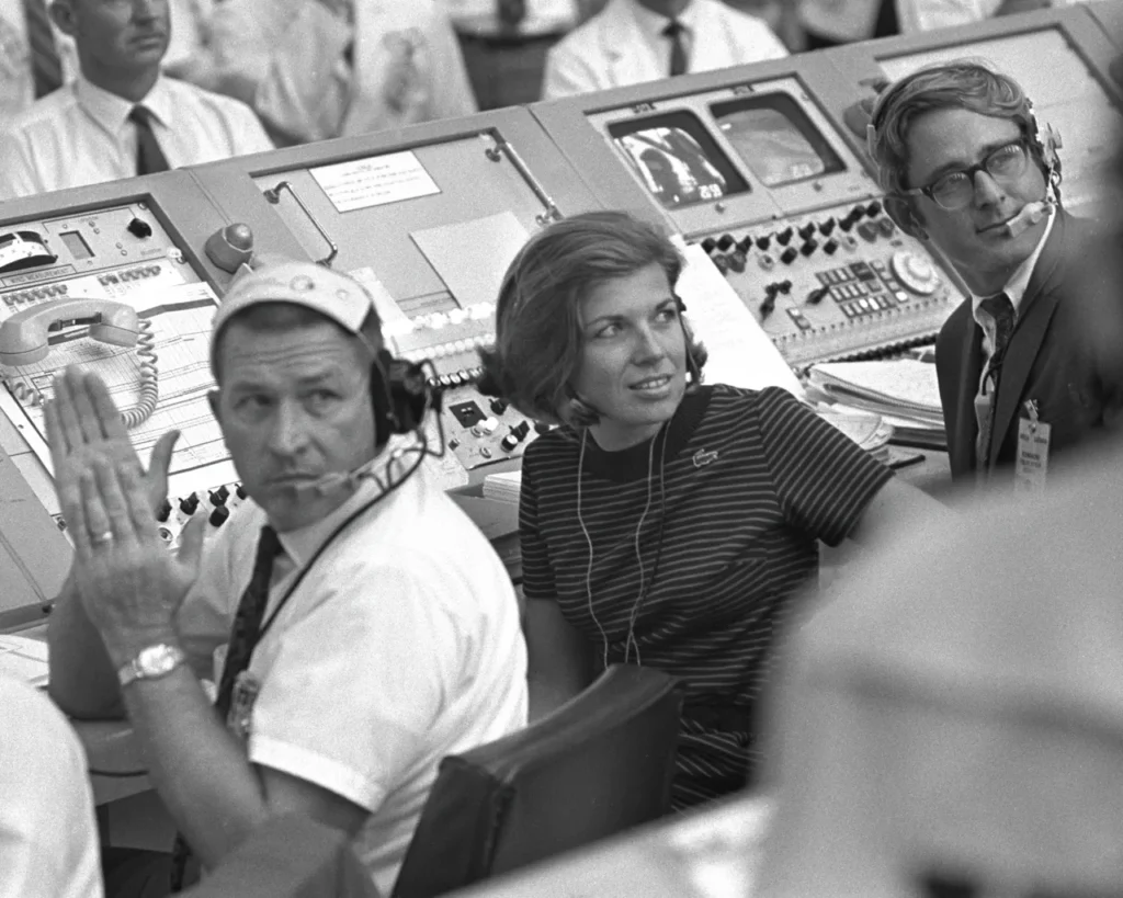 NASA control room staff applaud successful Apollo space launch circa 1960s